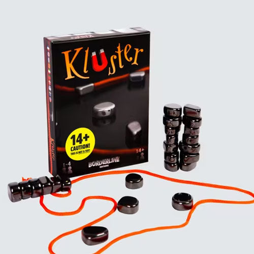 Kluter game set with packaging and game pieces on a light gray background
