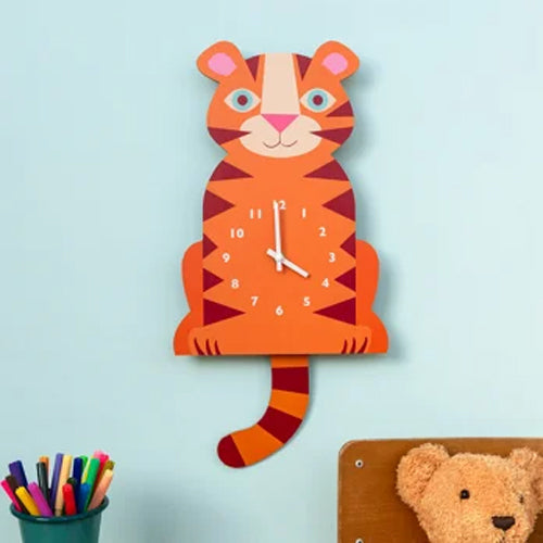 Children's wall clock shaped like a tiger on a light blue background