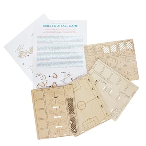 Wooden table football game set with instructions on a white background